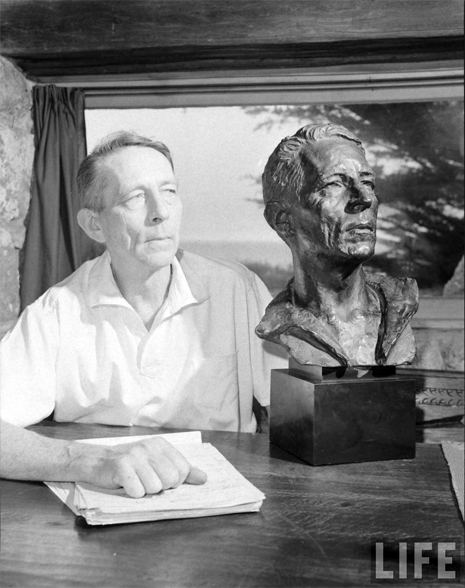 Image of Poet Robinson Jeffers posing next to his bust sculpted by Jo Davidson